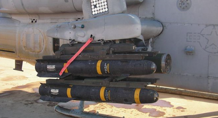 AGM-114 Hellfire-II missiles loaded on a dedicated attack helicopter.