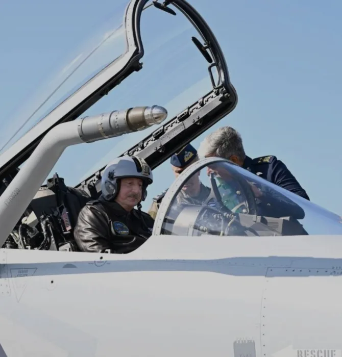 Photo of the President of Azerbaijan inspecting the cockpit of a JF-17 fighter aircraft. This image is a hero for an article.
