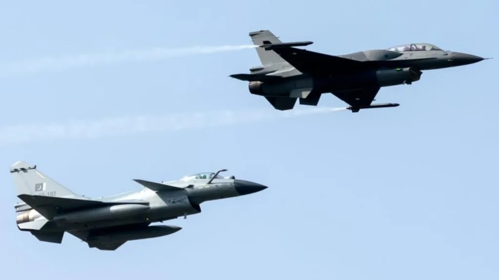 Photo of a fly-by featuring a Pakistani F-16C or D and a Pakistani J-10CE.