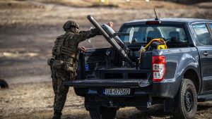 A Polish soldier prepares to launch a Surveyor interceptor drone from the Merops counter-drone system during a training exercise in Poland