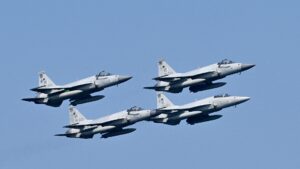 four-ship formation of JF-17 Thunder fighter aircraft, photo used for article on Pakistan's conventional strike posture and national security policy.