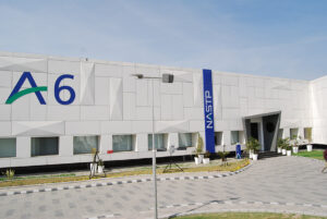 The NASTP "A6" aerospace building at the National Aerospace Science and Technology Park's Alpha cluster, marked with the A6 and NASTP signage, under a clear sky.