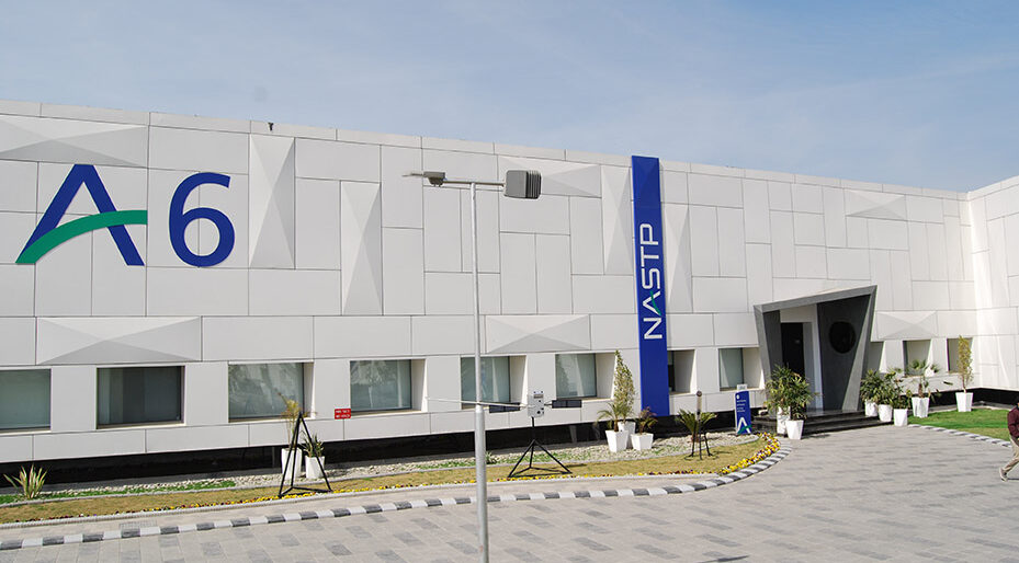 The NASTP "A6" aerospace building at the National Aerospace Science and Technology Park's Alpha cluster, marked with the A6 and NASTP signage, under a clear sky.