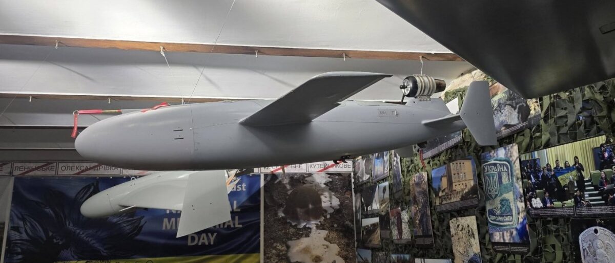 Ukraine's BARS jet-powered missile-drone on display, showing the miniature turbojet engine mounted externally above the tail of the fuselage