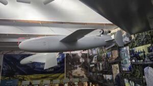 Ukraine's BARS jet-powered missile-drone on display, showing the miniature turbojet engine mounted externally above the tail of the fuselage
