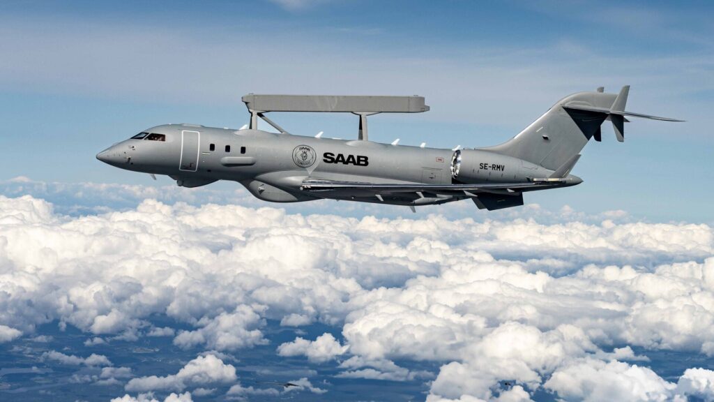 Saab GlobalEye AEW&C aircraft in flight above clouds