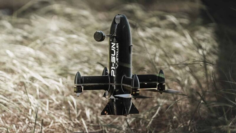 SkyFall's P1-SUN JetKiller interceptor drone in flight over grassland