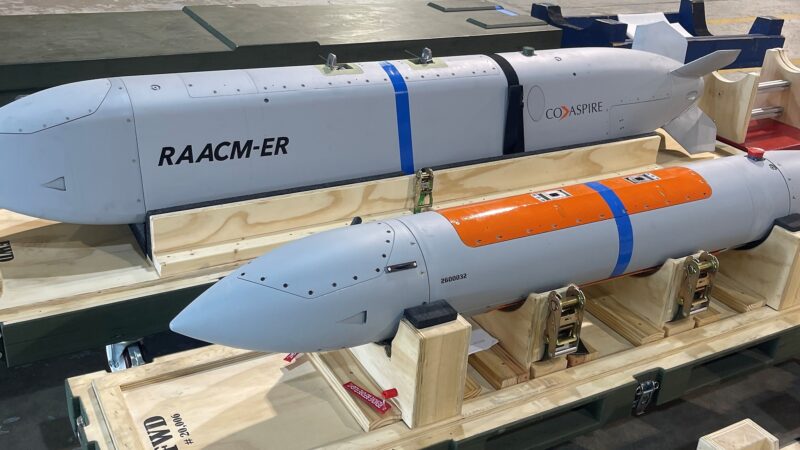 CoAspire RAACM-ER and RAACM low-cost cruise missiles on shipping cradles at a July 2026 flight test event, the design selected by the US Navy for the CHAOS program