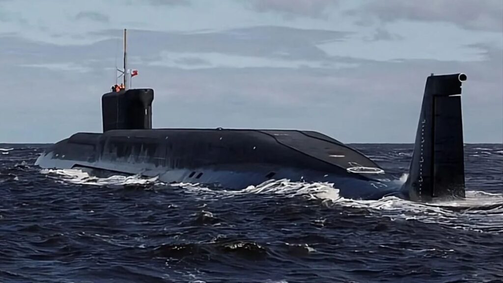 Arihant-Class - Quwa Submarine partially surfaced in rough open sea with a tall conning tower and periscope mast visible