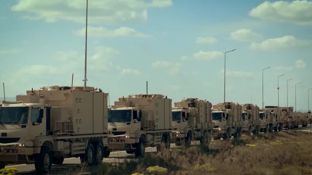 Truck-mounted military systems lined up along a road in an ASELSAN announcement image