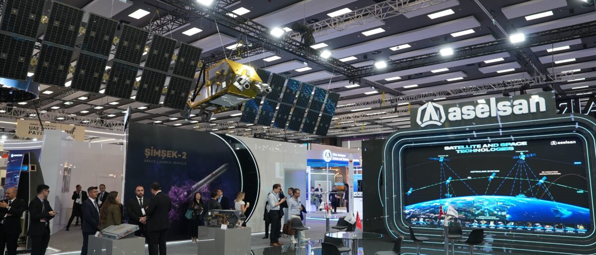 ASELSAN’s IAC 2026 stand with a satellite model and ASTRALINK network display