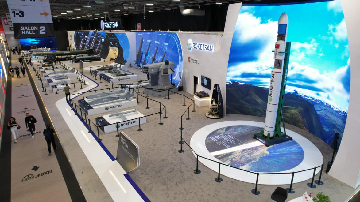 ROKETSAN exhibition stand at IDEF 2025 in Istanbul with missiles and a launch vehicle on display